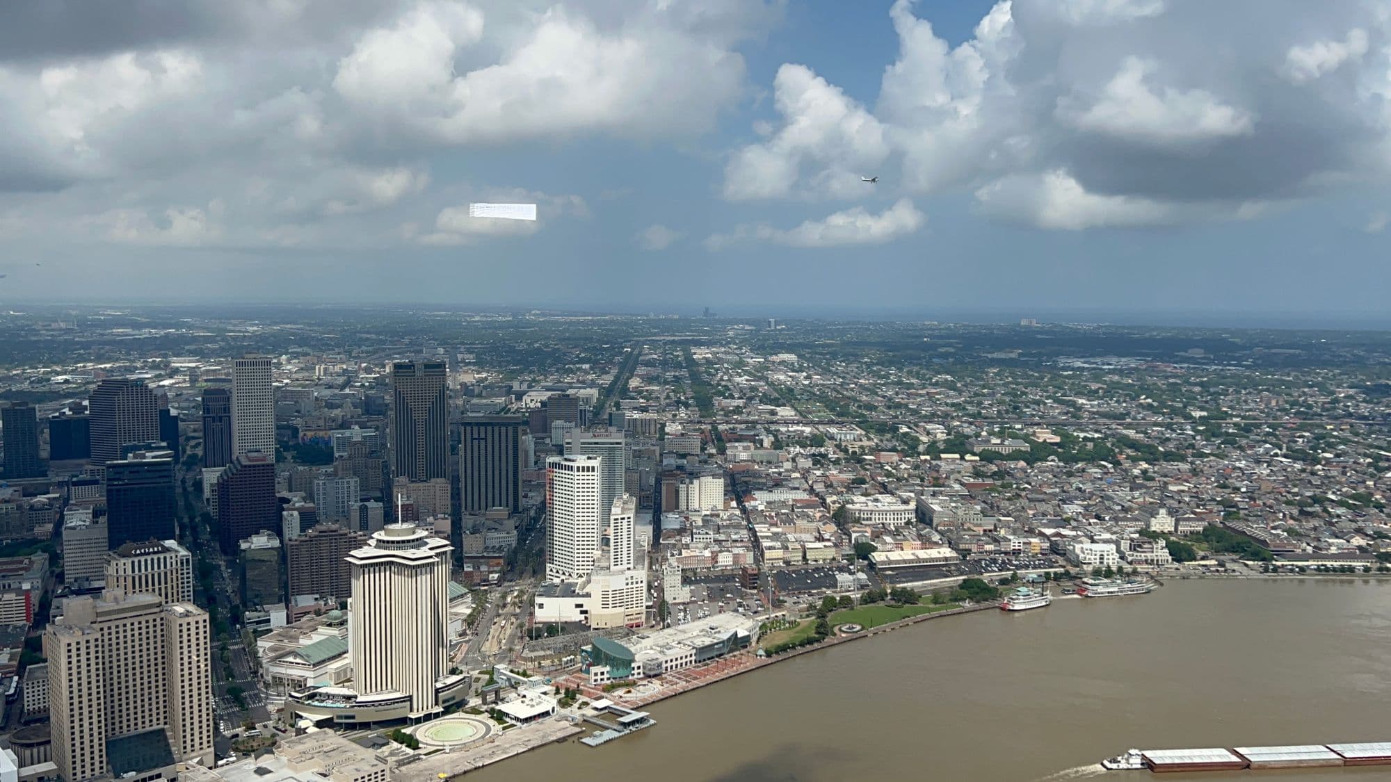 Pelican Sky banner tow aircraft flying a campaign over downtown New Orleans